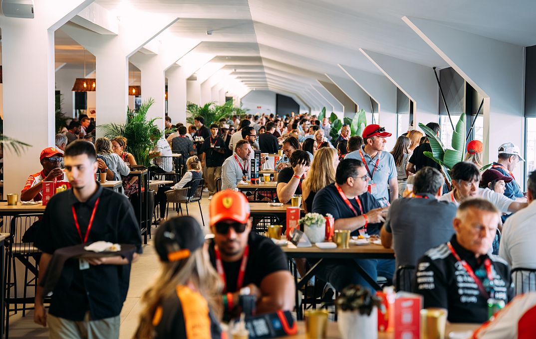 guests sitting in The Podium restaurant while watching the race